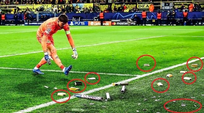 نقود وذهب تنهمر على أرضية ملعب في إحدى مباريات دوري الأبطال "شاهد"